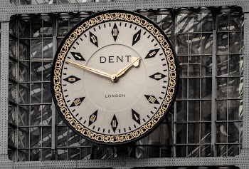 White Dent London Analog Wall Clock Hanging on Wall