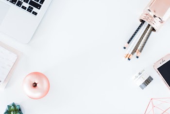White desktop with copper details