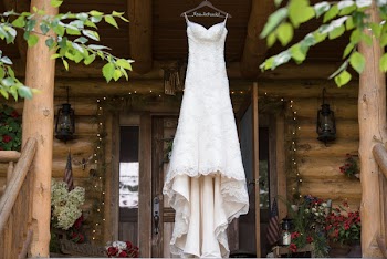 White Dress Hanging In Front Of Cabin