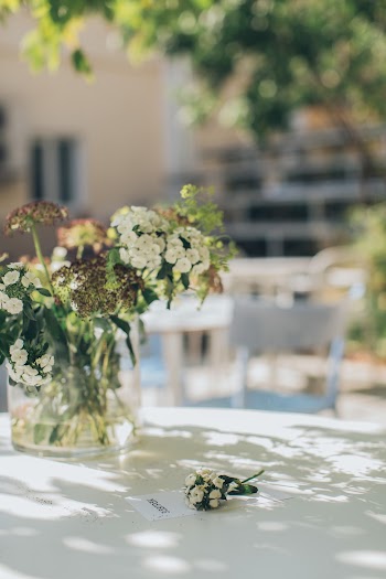 White Flowers In A Glass Vase On Table