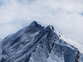 white fogs on mountain filled with snow