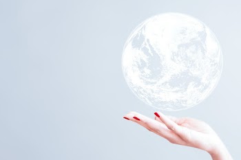 White globe over woman's hand psd gray background