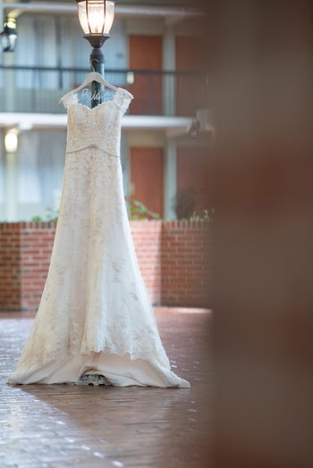 White Gown Hung Under A Lamp Post
