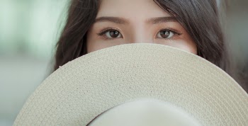 White Hat in Woman's Face