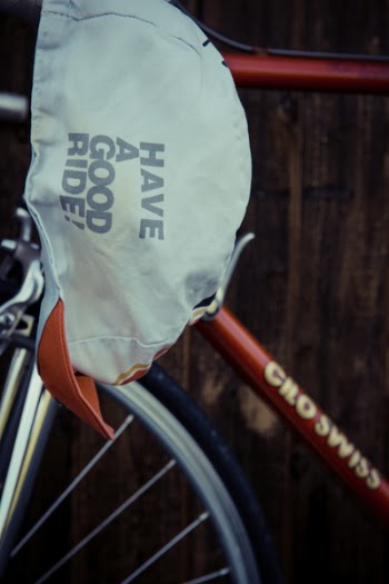 White Have a Good Ride Cap on Red Cilo Swiss Bicycle Frame