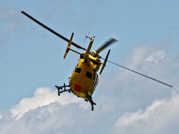 White Helicopter Below White Clouds