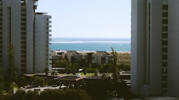white high rise buildings near beach