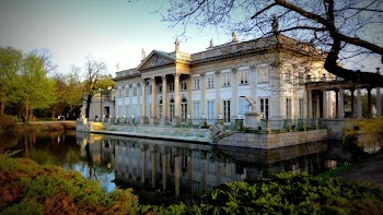 White House Beside Calm Body of Water