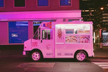 white ice cream truck parked on road