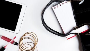 White Ipad Near Red Lip Gloss and Gold Bangles
