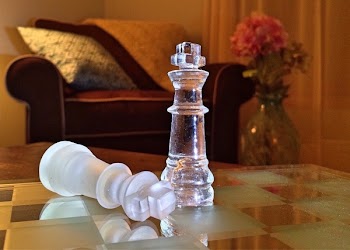 White King Chess Piece on Chess Board