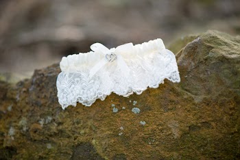 White Lace Textile on Brown Rock