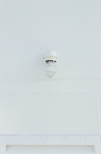 white lamp mounted on wall