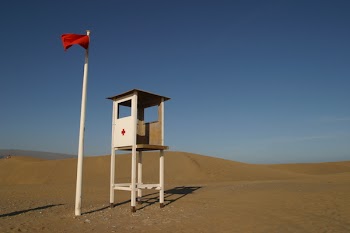 White Lifeguard House on Sand