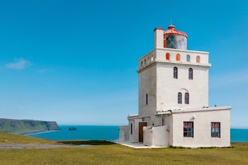 White Lighthouse and Body of Water