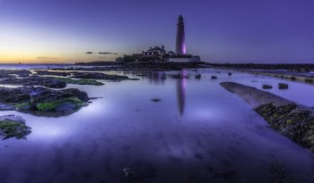 White Lighthouse Beside Body of Water