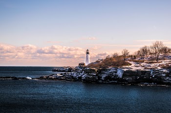 White Lighthouse during Cloudy Day