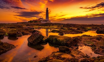 White Lighthouse during Golden Hour