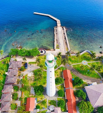 White Lighthouse Near Body of Water