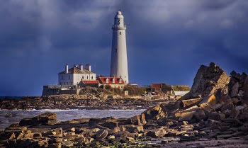 White Lighthouse Near Body of Water