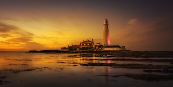 White Lighthouse Near Seashore