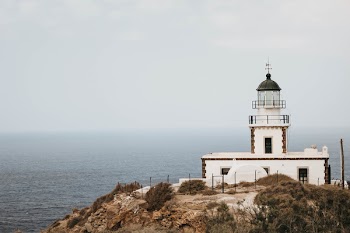 White Lighthouse On Cliff 