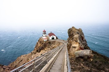white lighthouse on the cliff