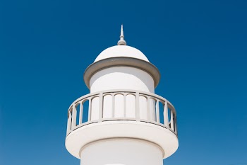 White Lighthouse Under Blue Sky