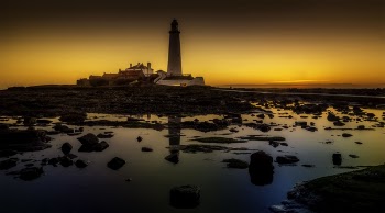 White Lighthouse Under Sunset