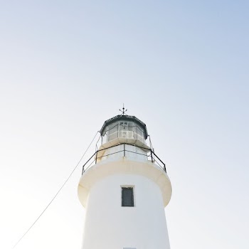 White Lighthouse Under White Sky
