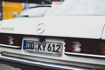 white Mercedez Benz car with license plate DD KY 612