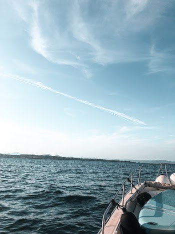 White Motorboat on Body of Water