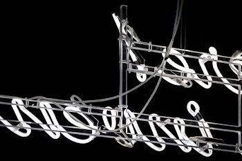 white neon sign on gray frame