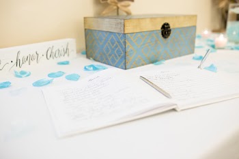 White Notebook Beside Chest Box