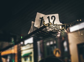 white number cards on top of track