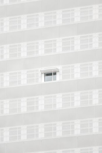 white opened window on building