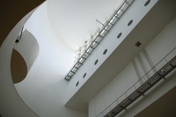 White Painted Building Interior With Wall Bridges