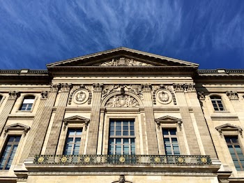 White Painted Building Under Blue Skies during Daytime