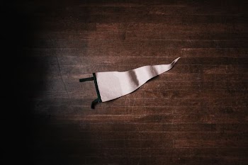 white pennant on brown surface