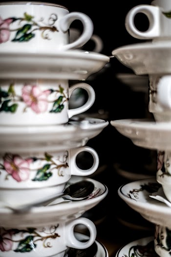 White, Pink, and Green Floral Ceramic Teacups and Saucers