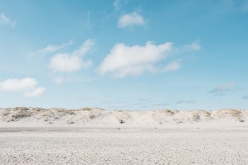 white plain under blue sky at daytime