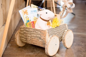 White Plush Toy on Brown Cart