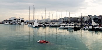 White Power Boat and Yacht Parked on Body of Water