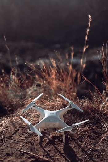 White Quadcopter Drone on Land