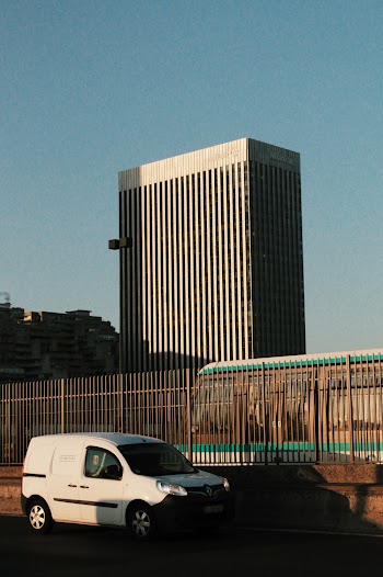 White Renault Kangoo Parked Near Metal Fence