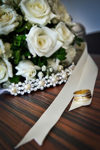 White Roses Bouquet Beside Gold-colored Ring