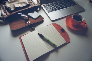 White Ruled Paper Under Green Ball Point Pen