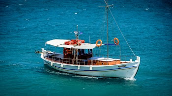 White Sail Boat On Sea