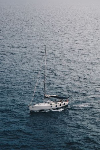 white sailboat on ocean