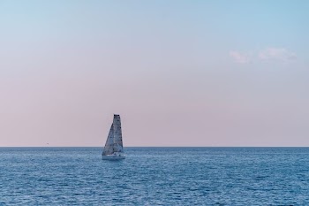 white sailboat on ocean during daytime